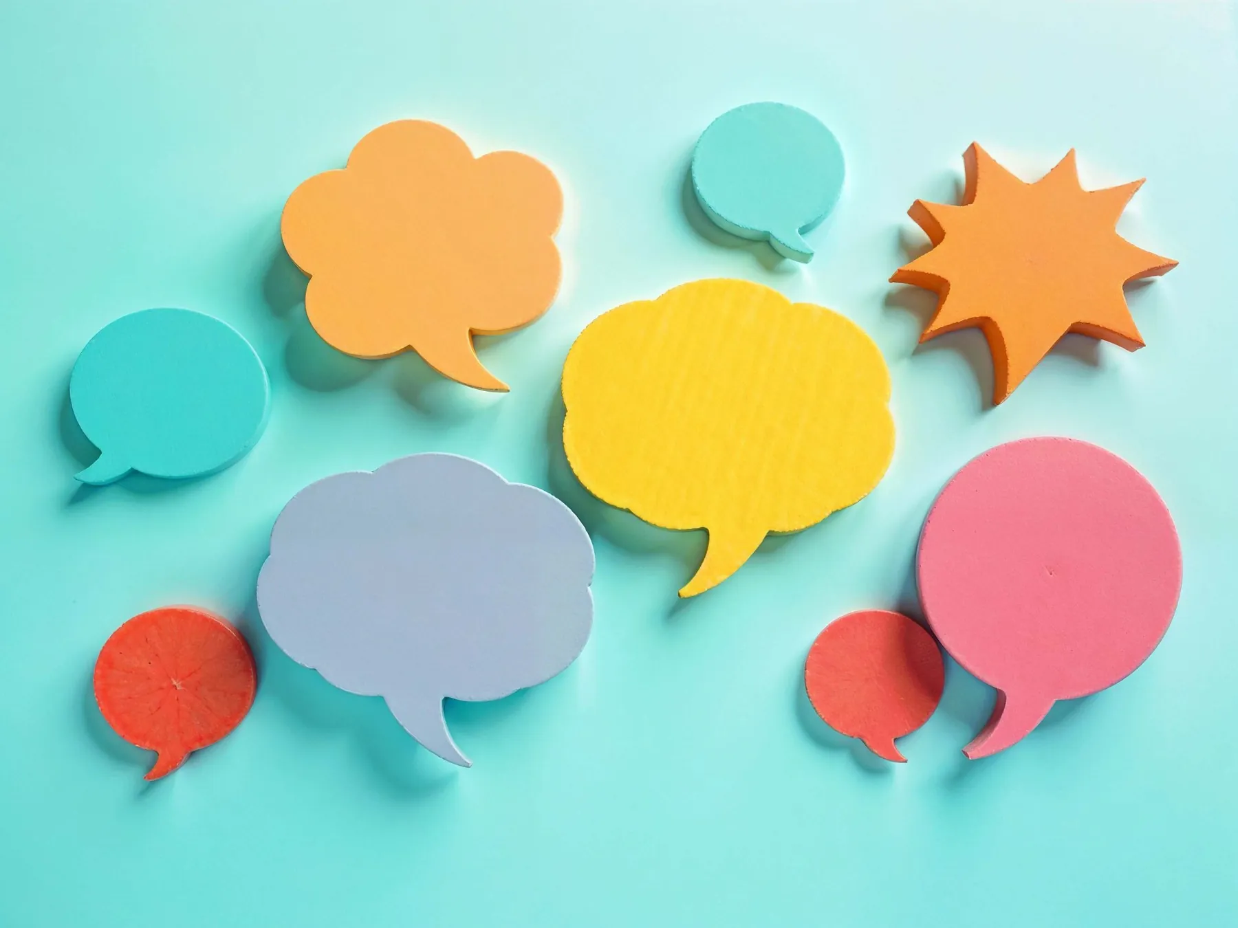 Colourful speech bubbles on a turquoise background