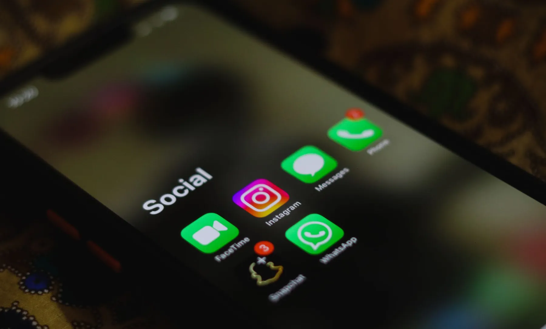 A phone screen showing a folder of social media apps
