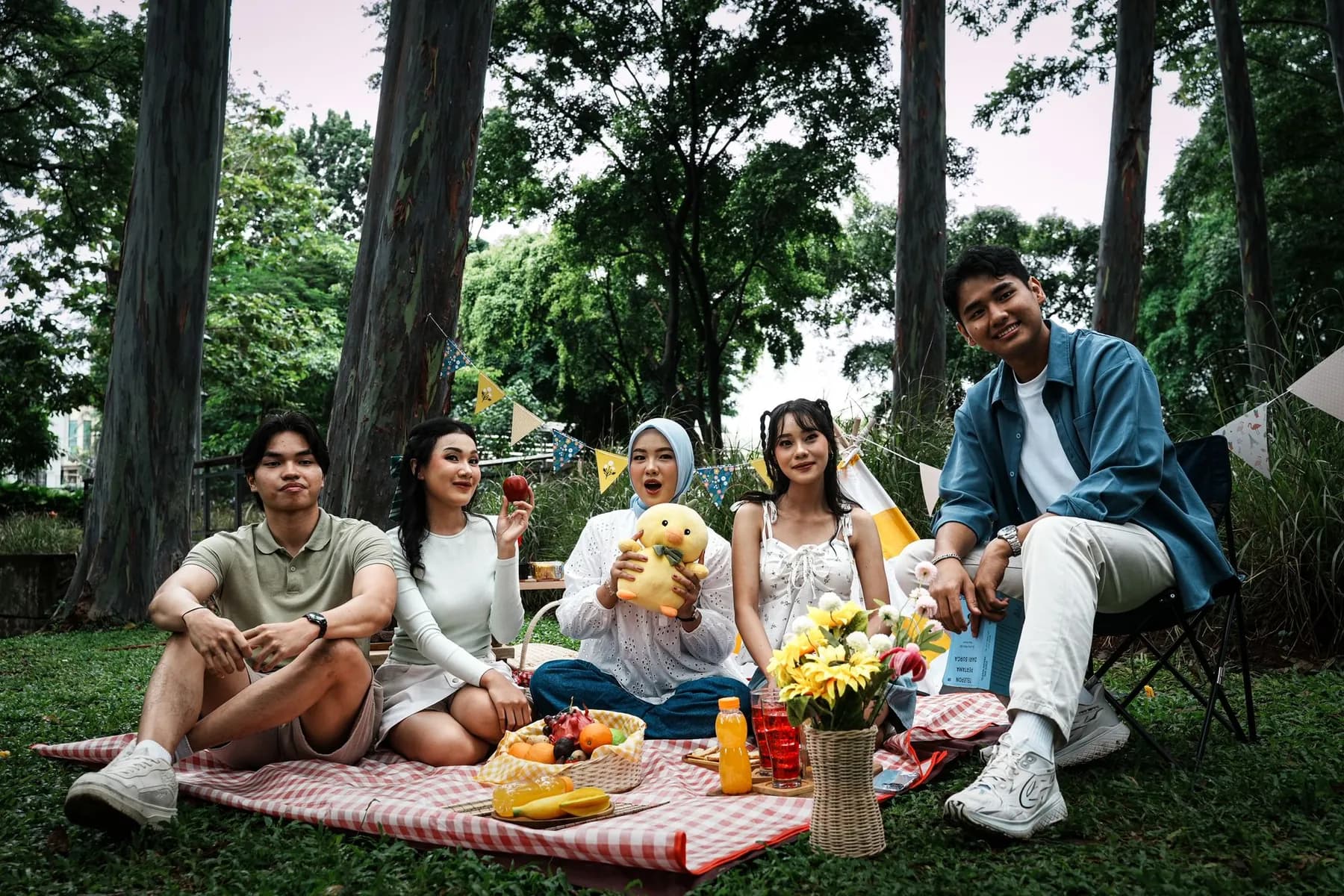 Friends having a picnic in a park