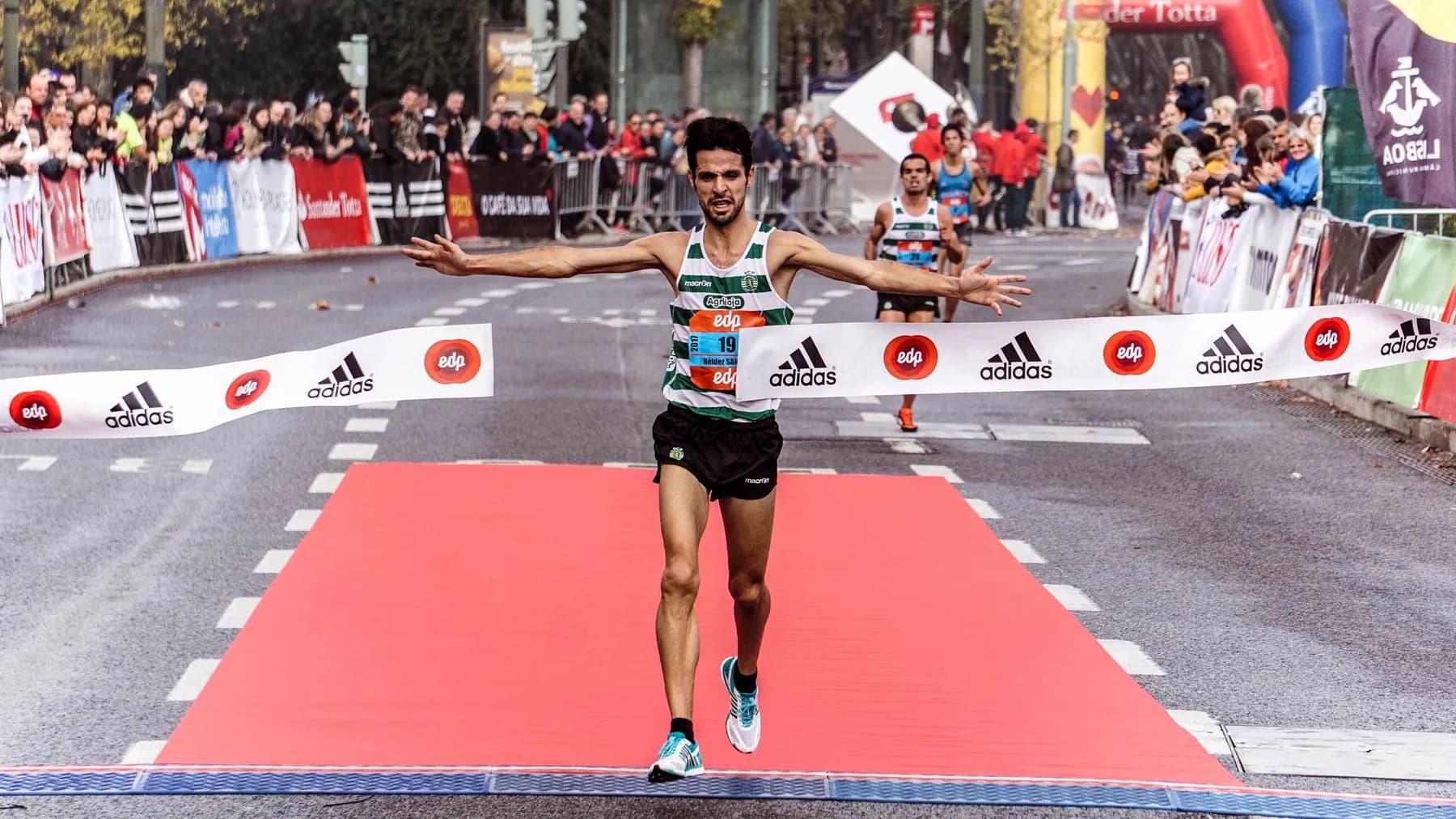 A runner crossing the finish line