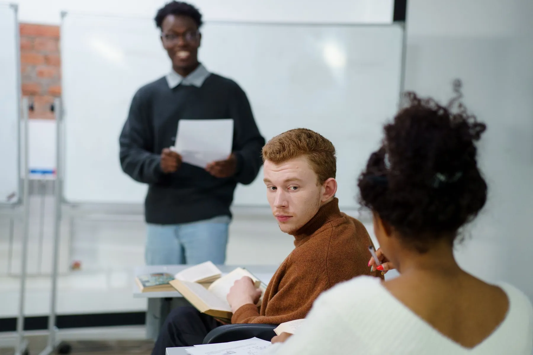 A student giving a talk to his classmates