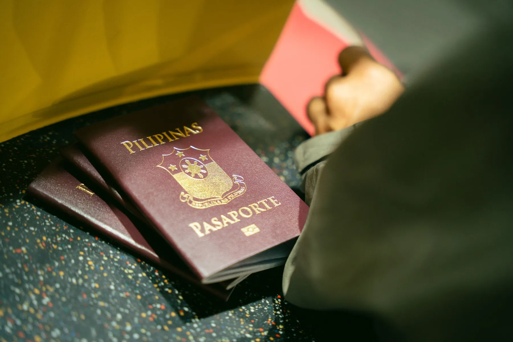 Passports lying next to a bag