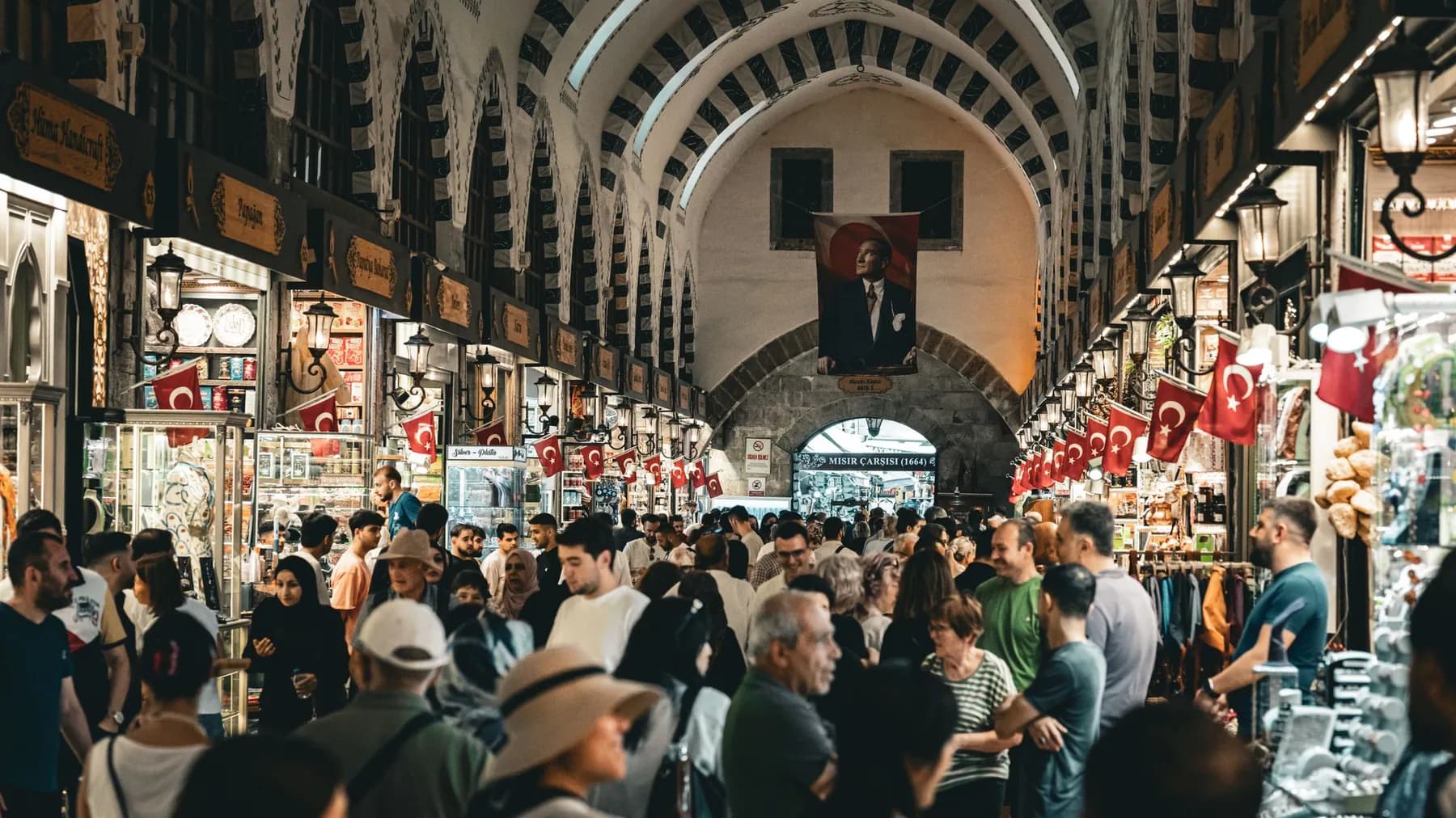 A covered bazaar packed with people