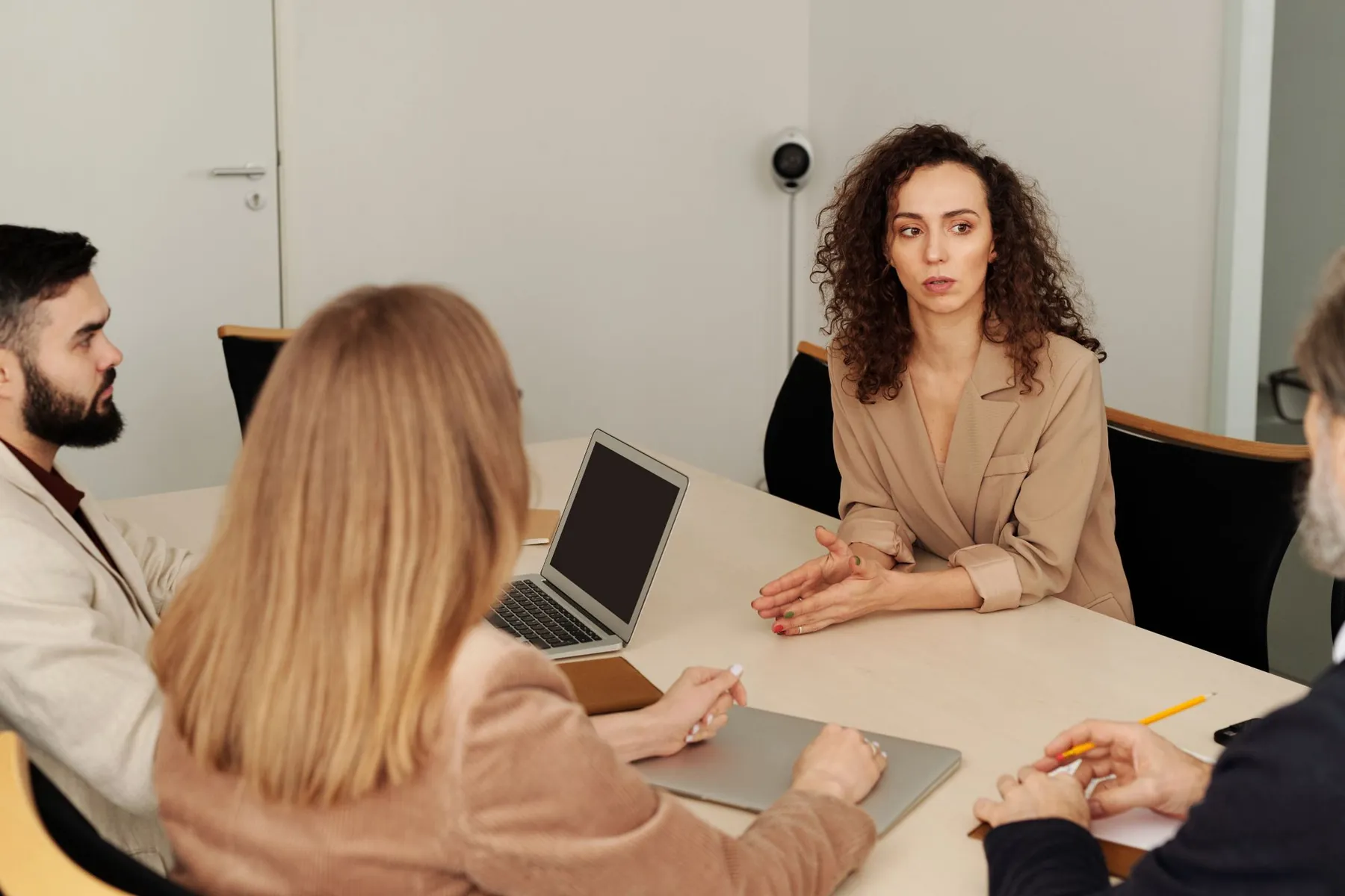 A group of people discussing ideas around a table